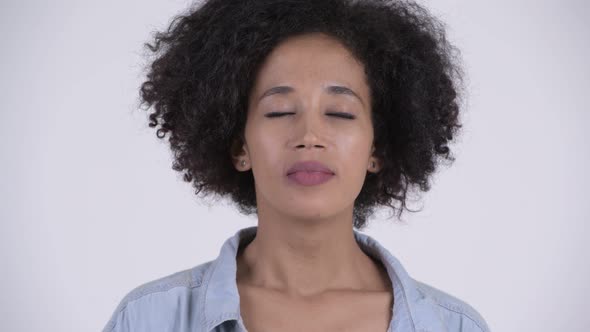 Face of Young Happy African Woman Relaxing with Eyes Closed