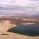 Panoramic View From Above on a Sandy Desert with Lakes. - VideoHive Item for Sale