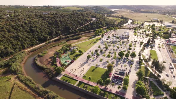 Aerial view of the Municipal pools of Silves complex surrounded by Arade River.
