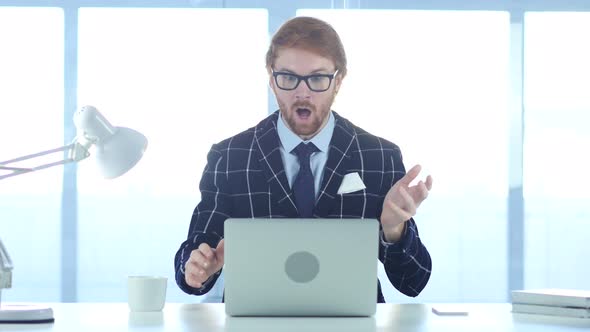 Redhead Businessman Shocked, Stunned with Hand on Mouth