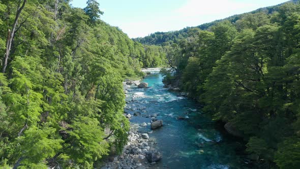 Drone Over River Between Trees