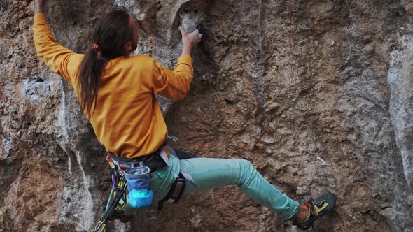 Rock Climber on Overhanging Cliff