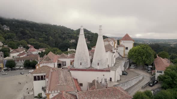 Palace of Sintra, also called Town Palace, with two distinctive chimneys, Portugal. Circling shot