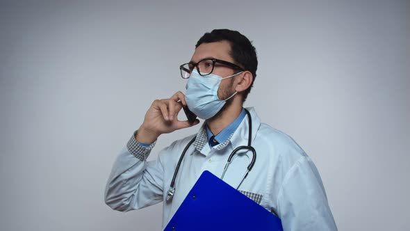 Arabic Doctor Having a Conversation on the Phone