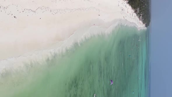 Vertical Video Boats in the Ocean Near the Coast of Zanzibar Tanzania Aerial View