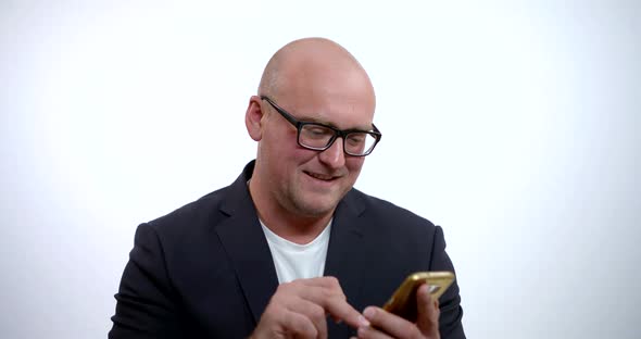 Businessman Taps on Phone in White Background Slow Motion