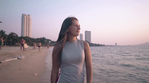 Pretty Brunette Lady Walks Along Ocean Coast Slow Motion