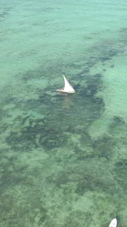 Vertical Video Boats in the Ocean Near the Coast of Zanzibar Tanzania