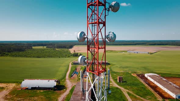 Aerial View of 4G and 5G Cell Tower with Antennas and Satellites