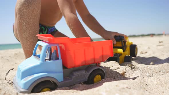 Closeup of a Toy Car Falling Sand