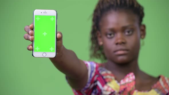 Young African Woman Showing Phone