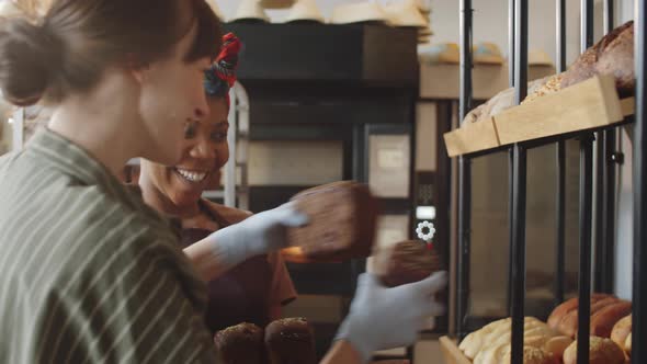 Cheerful Multiethnic Women Working in Bakery