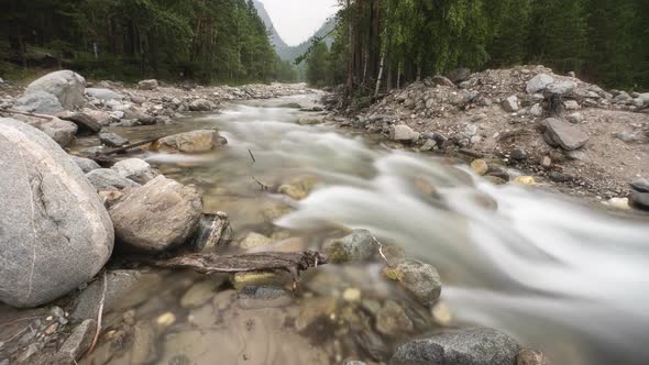 Arshan Mountain River Water in a Mountain River Like Foam, Long Exposure. Timelapse.