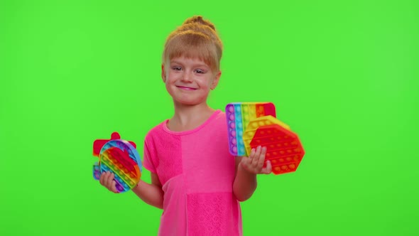 Child Girl Kid Holding Many Colorful Squishy Silicone Bubbles Sensory Toy Kid Playing Pop It Game