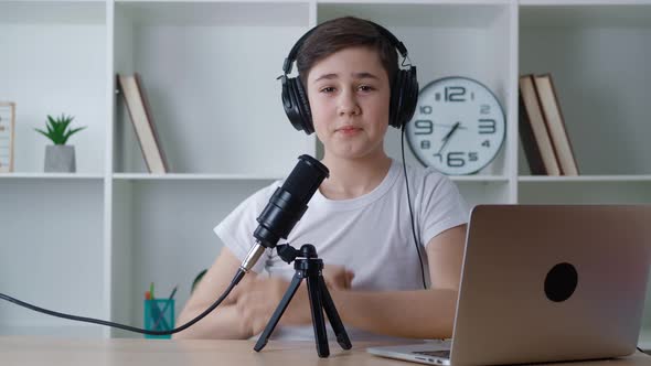 Boy Vlogger Look at Camera and Recording Podcast Video for Internet