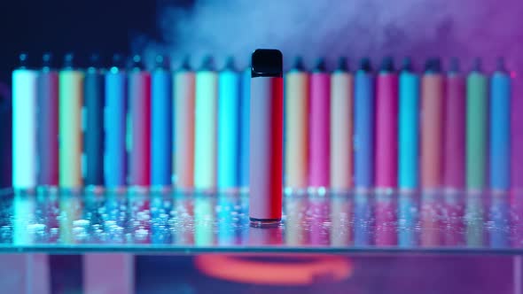 ECigarettes and Vapes with Smoke in Neon Lighting