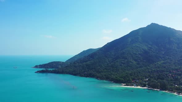 Aerial above tourism of exotic island beach vacation by blue green ocean and white sandy background 