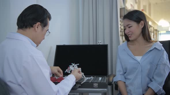 Optical shop concept. The ophthalmologist is measuring the customer's eyes. 4k Resolution.