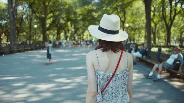 Young girl walking in the park, NYC