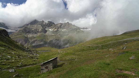 Clouds Time Lapse Over a Mountain Valley at the Swiss Alps, Switzerland.