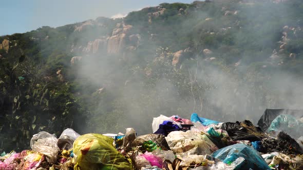 Close up shot of burning  trash,plastic and garbage in Vietnam during summer.Environmental air pollu