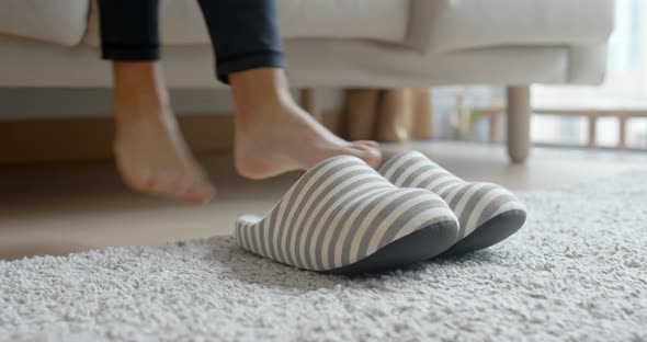 Woman wear slipper at home