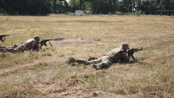 In Battlefield Soldiers with Weapons and Ammunition is Attacking Enemy Military Special Forces