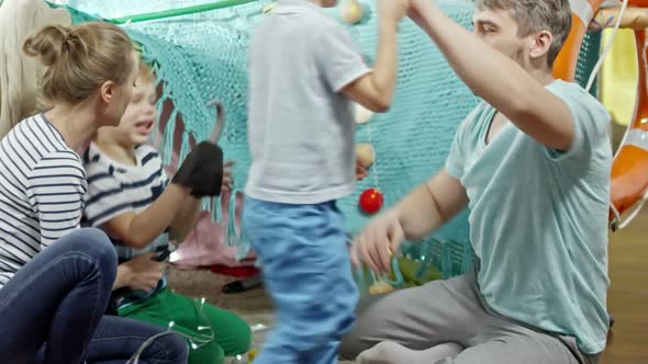 Little Boys Playing with Parents at Home alt