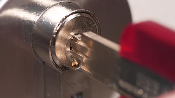 4K - Key opens high security cylinder lock. Close-up