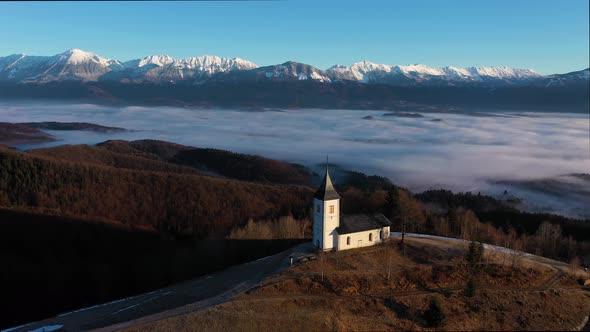 Church of St. Primoz and Felicijan on Sunny Day. Julian Alps. Jamnik, Slovenia