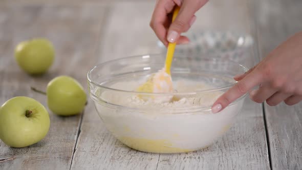 Process of Making and Whisking the Dough, Woman's Hand Mixing Liquid Dough.