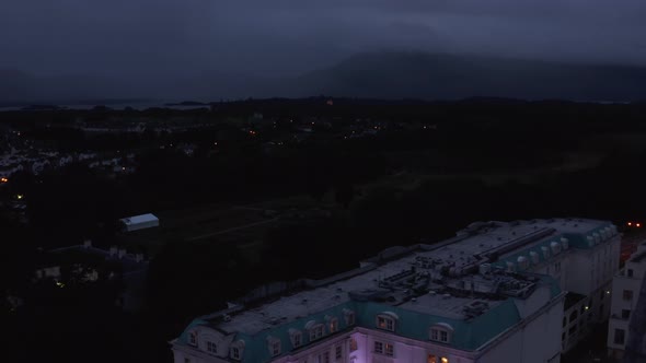 Backwards Reveal Historic Town Centre in Evening