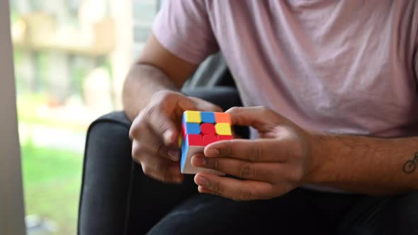 Young Man Solving A Rubiks Cube Long Clip 4