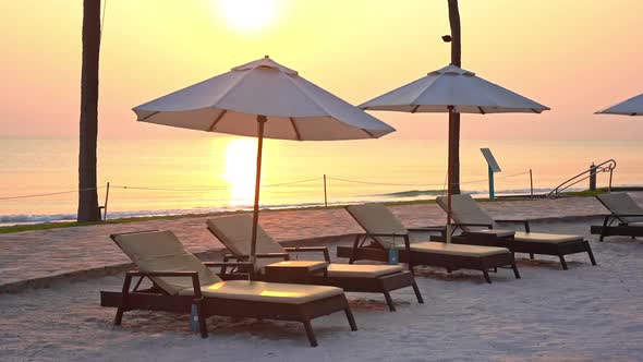 Beautiful tropical sea beach around with umbrella chair on blue sky