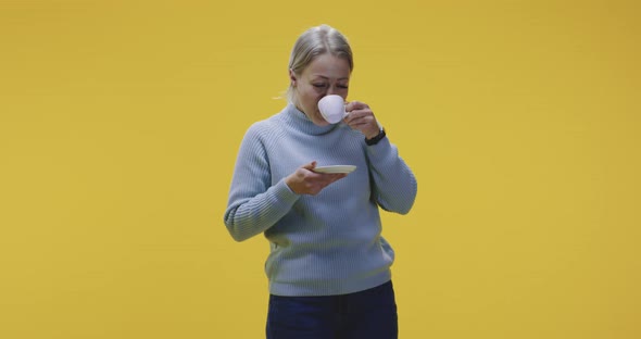 Young Woman Drinking Coffee