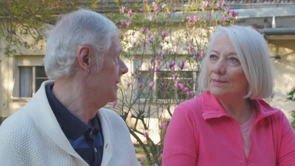 Slow Motion of Elderly Retired Couple Talking Outdoor