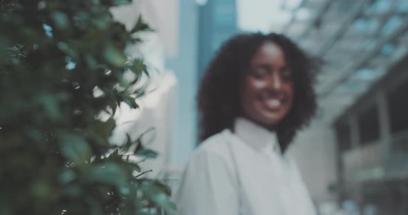 Young woman looks at the camera and smiles