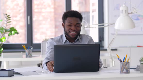 Businessman Having Video Chat on Laptop at Office 32