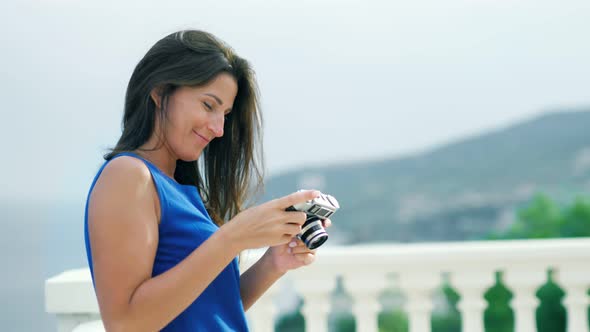 Side View Smiling Elegance Female Tourist Taking Photo Using Professional Camera
