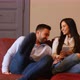 A young couple discussing content on a smartphone - VideoHive Item for Sale