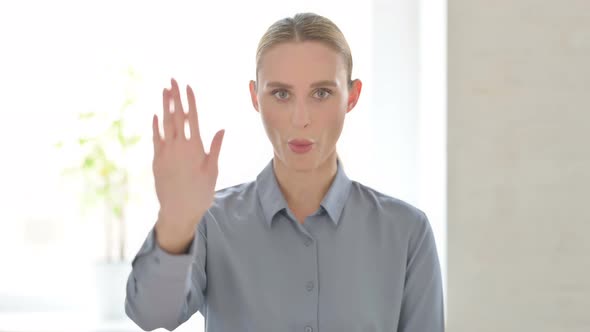 Portrait of Woman Showing Stop Gesture