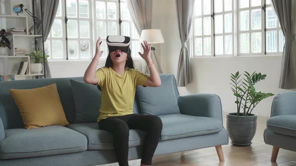 Asian Girl Explores Virtual Reality Device Interface