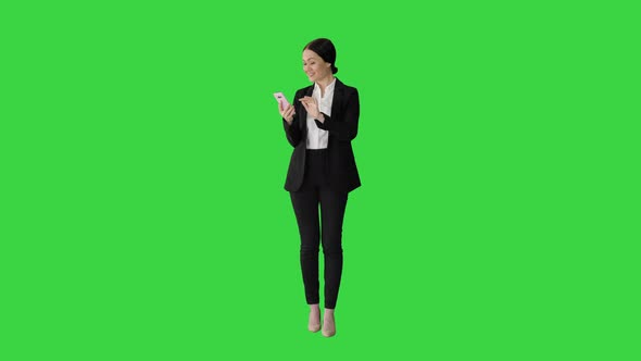 Smiling Businesswoman Checking Photos Her Phone Green Screen Chroma Key