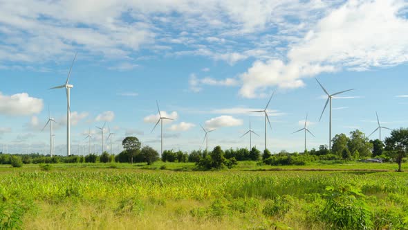 Time lapse of wind turbines or windmills farm field in industry factory. Power