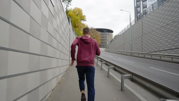 Man Jogging in City in Slow Motion