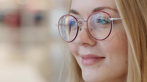 Extreme Closeup Face Smiling Young Girl in Glasses Caucasian Lady Satisfied with Service