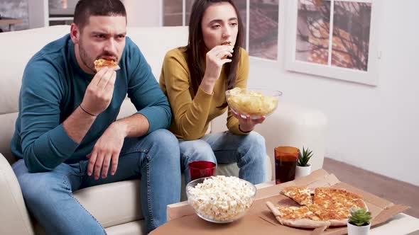 Scared Couple After a Frightening Moment in the Movie