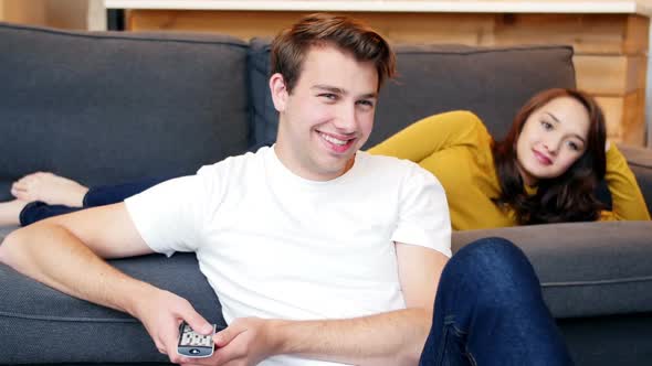 Couple embracing on sofa in living room