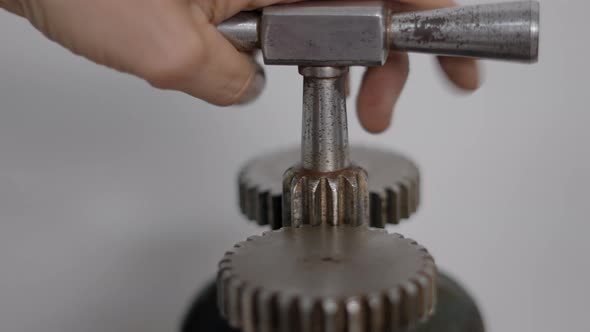 Close Up Of Rolling Mill Machine Lever Turned By Jeweler's Hand