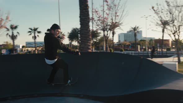 Skateboarder on a Pump Track Park